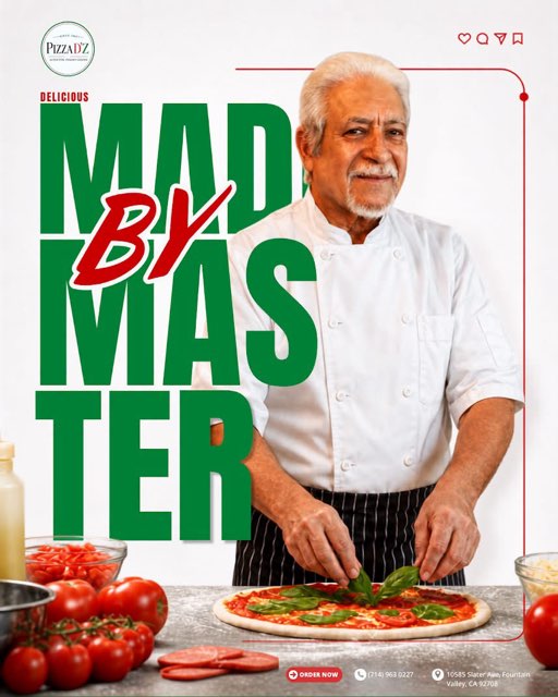 Our master chef topping a pizza with fresh basil