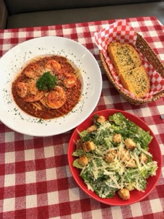 Shrimp pasta, Caesar salad and garlic bread