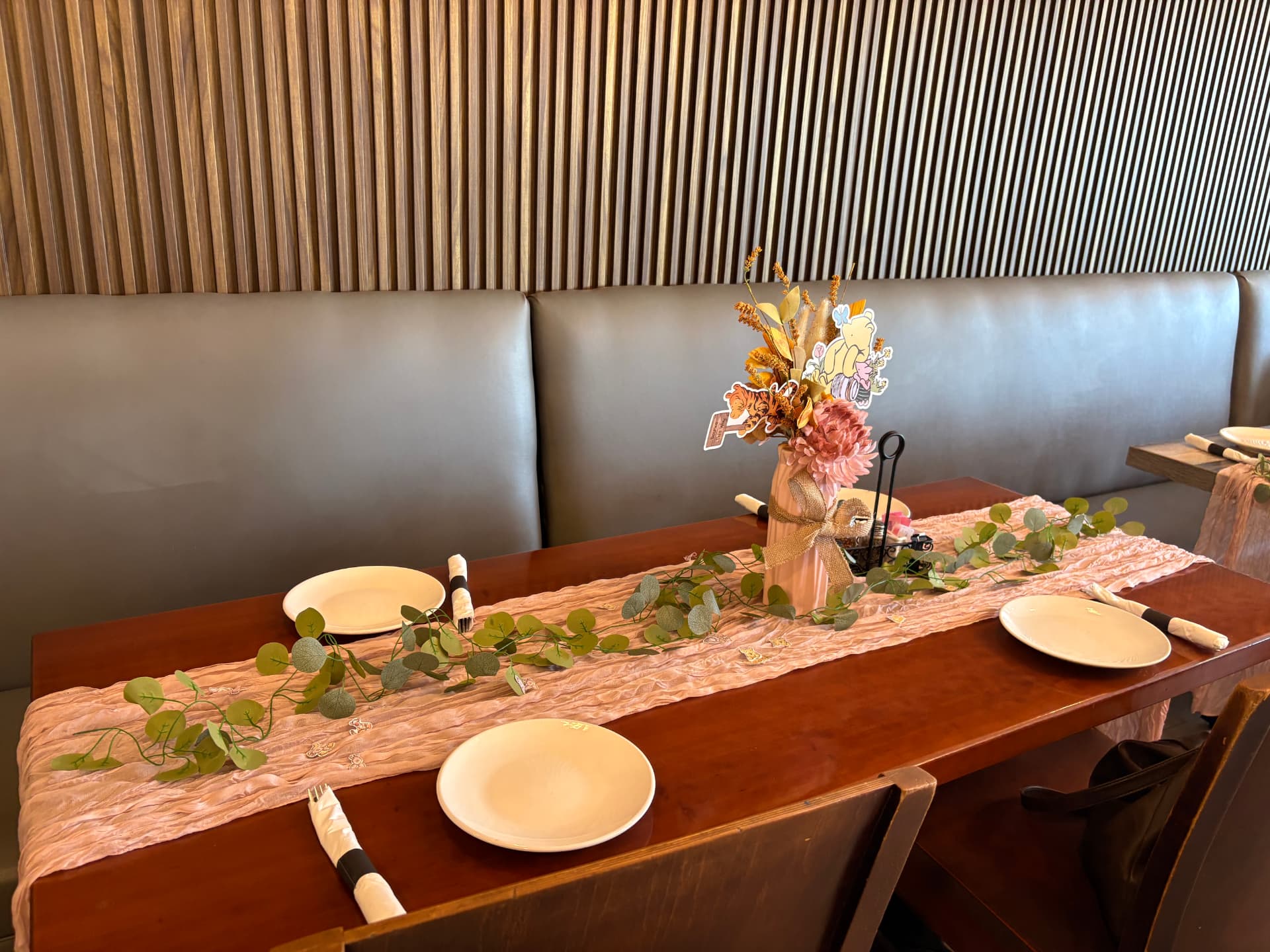 Booth table decorated for a baby shower