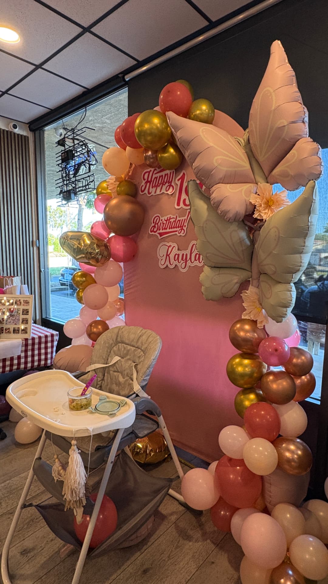 First birthday balloon backdrop with butterflies